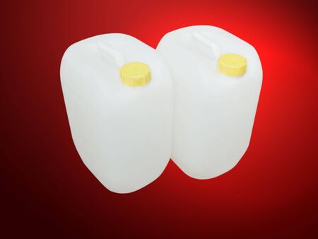 double white tanks on red background の写真素材