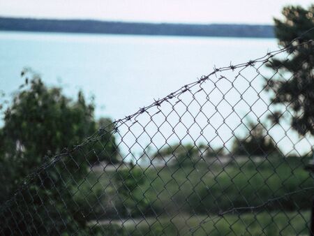 summer beautyfull river behind the fence in the countryの写真素材