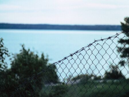 summer beautyfull river behind the fence in the countryの写真素材