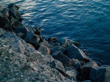 beautyfull rocky riverbank on a warm summer eveningの写真素材