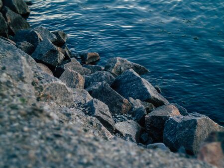 beautyfull rocky riverbank on a warm summer eveningの写真素材