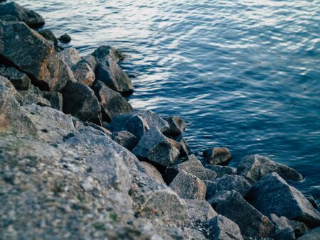 beautyfull rocky riverbank on a warm summer eveningの写真素材