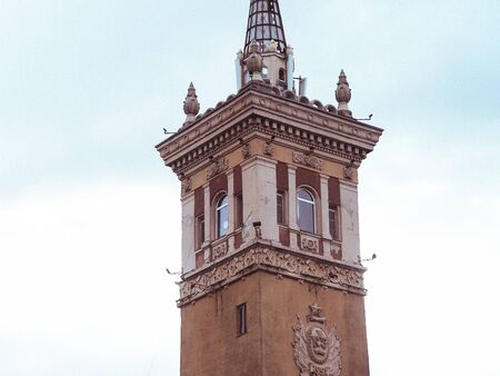 old beautyfull tower in the city center with a spireの写真素材