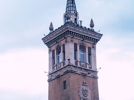 old beautyfull tower in the city center with a spireの写真素材
