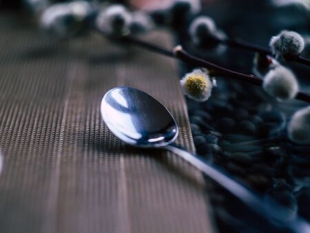 A coffee spoon lay on a table in a coffee shopの写真素材