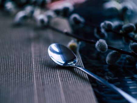 A coffee spoon lay on a table in a coffee shopの写真素材