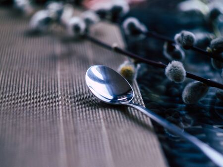 A coffee spoon lay on a table in a coffee shopの写真素材