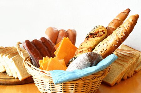 breads, sausages and cheese on white backgroundの写真素材