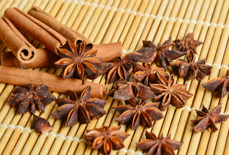 cinnamon with bamboo placemats background (soft focus, lens blur)の写真素材
