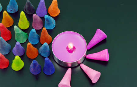 colorful incense or frankincense with candle (soft focus, lens blur)の写真素材