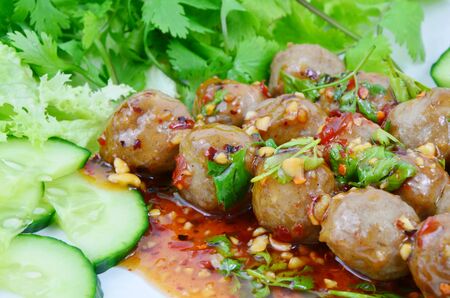Grilled beef meatballs with sweet and spicy sauce. (Soft focus, lens blur) Popular street foods.の写真素材