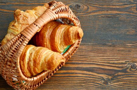 Corissants in the basket on wooden background.の写真素材