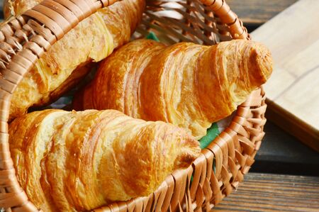 Corissants in the basket on wooden background.の写真素材