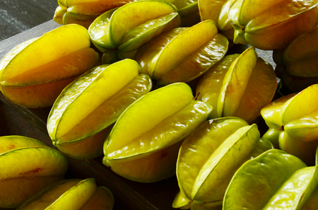 a lot of Averrhoa carambola, carambola or star apple in the market.の写真素材