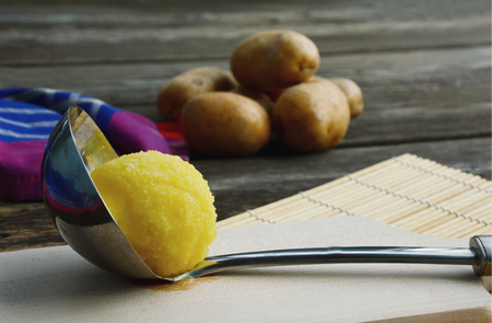 Boiled potato dumpling (German name is dumpling or potato dumplings) with shadow and wooden backgroundの写真素材