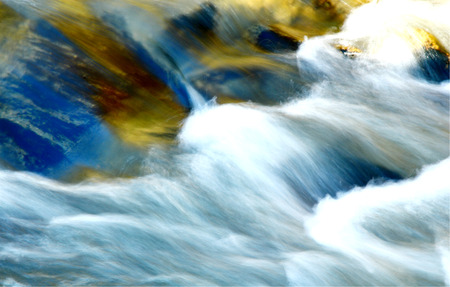 waterfall turbulent with colorful shadow