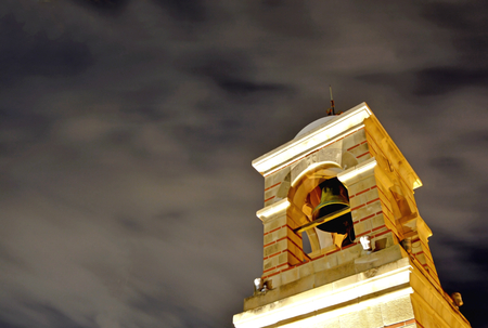 Bell tower in church in Lycabettus Hill at nightの写真素材