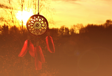 colorful of dreamcather with sun set and lean flare.の写真素材