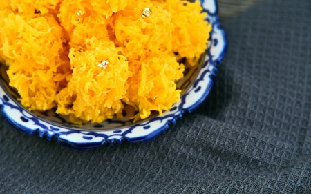 Crispy Golden Threads made from yolk eggs and syrup  (Thai name is Foi Thong).
Thai desert menu.の写真素材