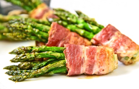 Bacon Wrapped Asparagus Bundles on white dish.
spring vegetable season with BBQ menu.の写真素材