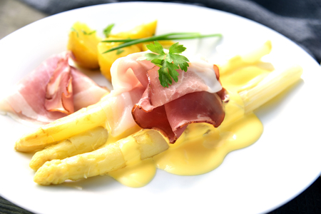 White Asparagus with Black Forest Ham and Hollandaise Sauce. Asparagus European menu.の写真素材