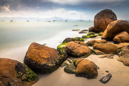 Beach with boats and sailboats in Jurere long exposure image - Florianopolis, Brazilの写真素材