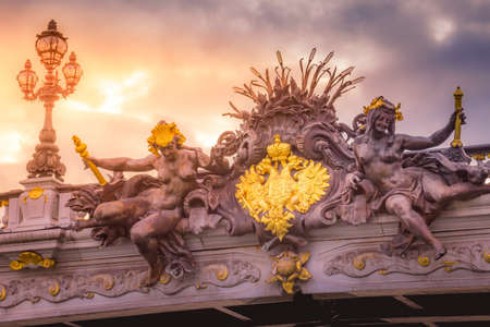 Golden sunrise and nymphs Sculpture in Pont Alexandre III, Paris, france