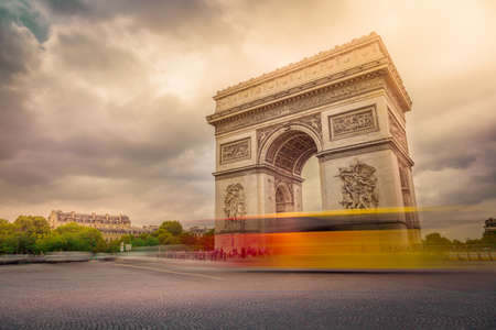 Triumphal Arch in Place Charles de Gaulle with blurred cars, Paris, Franceの写真素材