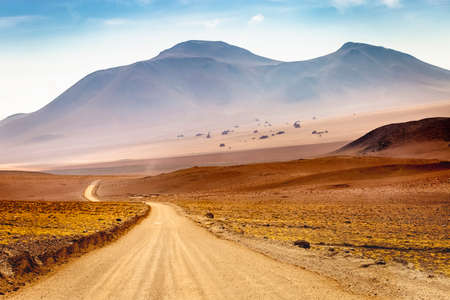 Country road in Atacama desert, volcanic arid landscape in Northern Chile border with Bolivia, South...