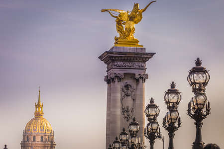 Line of Street lights and Invalides dome in Pont Alexandre III, Paris, franceの写真素材