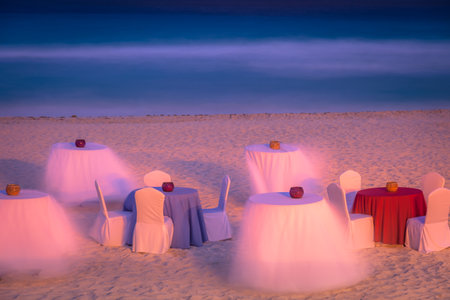 Cancun caribbean beach, chairs and tables at evening, Riviera Maya, Mexicoの写真素材