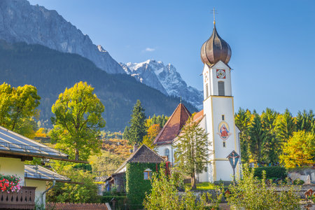 Church St Johannes, Wetterstein, Waxenstein and Zugspitze at sunrise, Grainauの写真素材