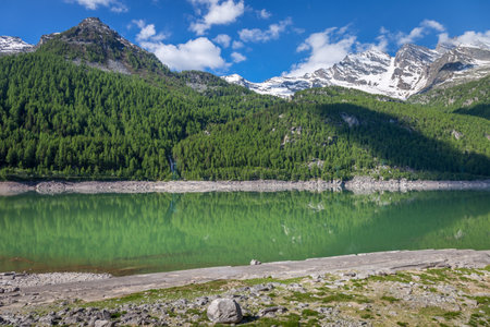 Alpine lake and dramatic landscape at springtime, Gran Paradiso alps , Italyの写真素材