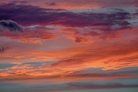 Sunrise dramatic sky with clouds in a row, colorful cloudscape