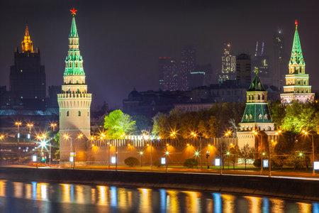 Kremlin towers illuminated at evening with river Moscva reflection, Moscow, Russiaの写真素材