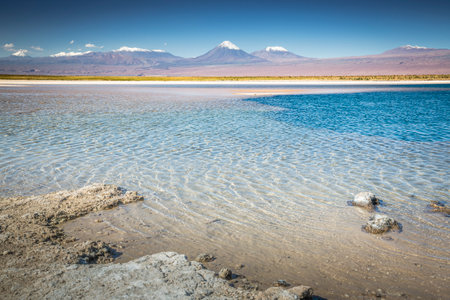 Licancabur volcanic landscape and salt lake reflection at sunset in Atacama Desert, Chile, South Americaの写真素材