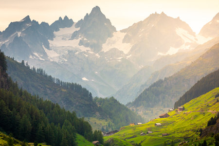 Alpine village and farms, Bernese Oberland swiss alps landscape, Susten Pass, Switzerlandの写真素材