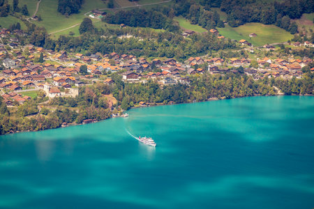 Aerial view of Swiss Alps and Lake Brienz with ferry boat at sunset, Interlakenの写真素材