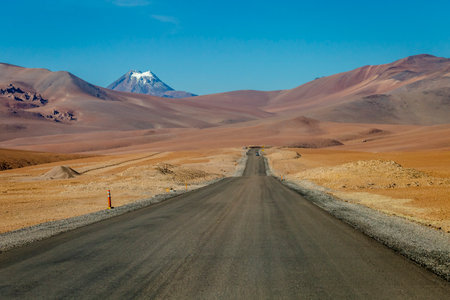 Road in Peaceful Moon Valley dramatic landscape at Sunset, Atacama Desert, Chile