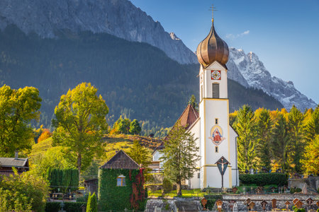 Grainau Church at golden autumn and Zugspitze, Garmisch Partenkirchen, Germanyの写真素材