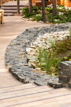 Landscape design the manufacture of granite stone laying an artificial reservoirの写真素材
