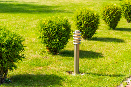 street metal chrome lamp on the lawn, horizontal frameの写真素材