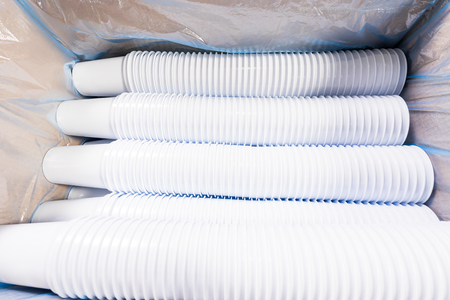 white plastic cups for food stuffed in a box for transportationの写真素材