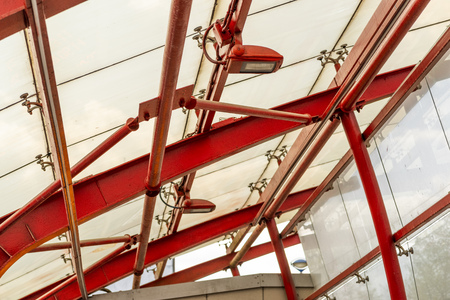 Metal and glass constructions with street lightsの写真素材