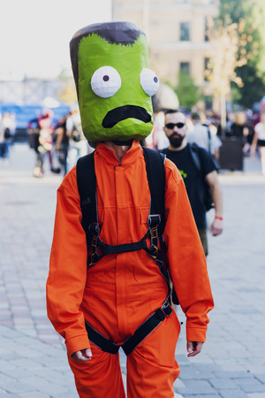 September 22, 2018 Kiev, Ukraine, Art Plant Platform. festival of modern pop culture COMIC CON. A suit with a green head and an orange overall from a computer gameのeditorial素材
