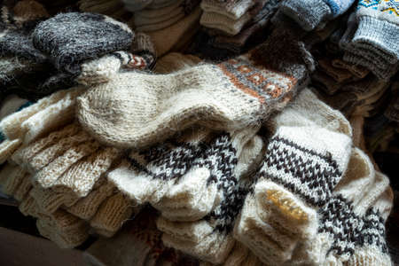 knitted wool socks of different sizes for sale on the shelves