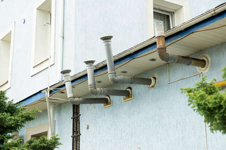 ventilation pipes of hoods on a building wallの写真素材