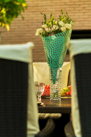 bouquet with eustoma flowers in a vase on the tableの写真素材