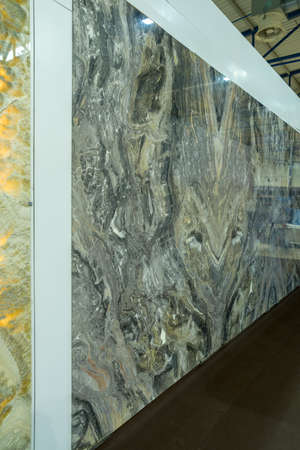 stone with a pattern of an abstract background attached to a demonstration wallの写真素材