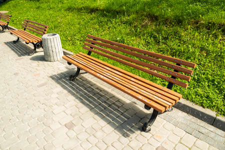 wooden seating in the city on a sunny day